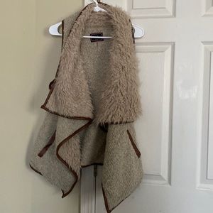 fuzzy wool vest light tan size medium.